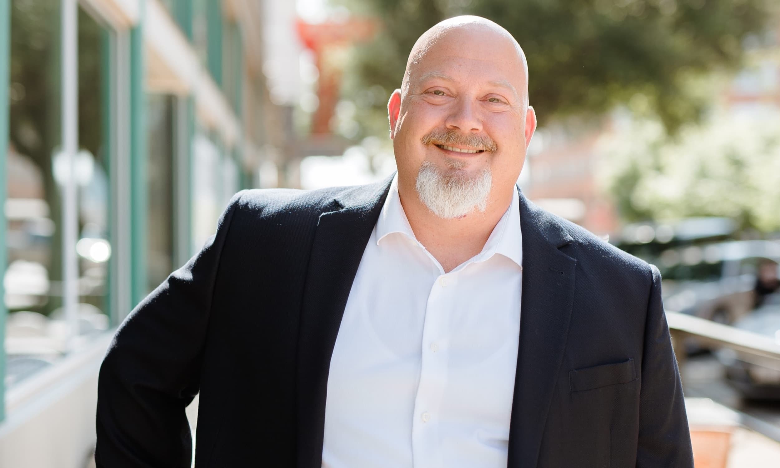 Dusty Potter, founder of amplifyOMS, outside one of his Texas hearing care clinics.